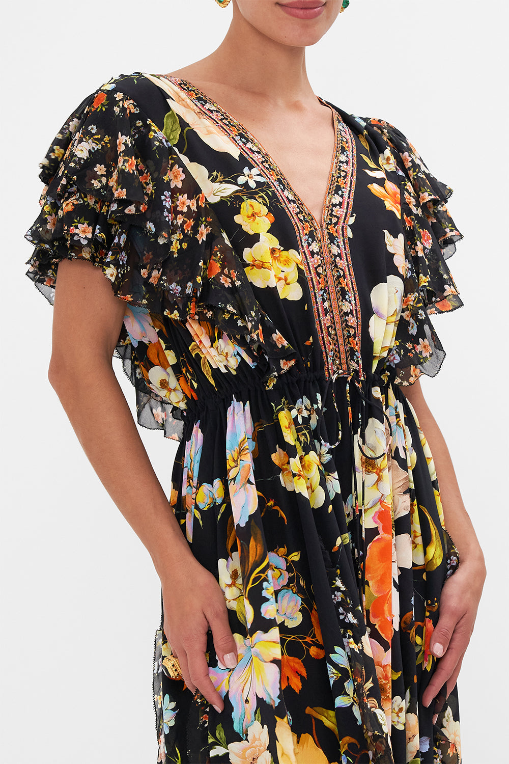 Detail view of model wearing CAMILLA silk ruffle maxi dress in Secret History floral print