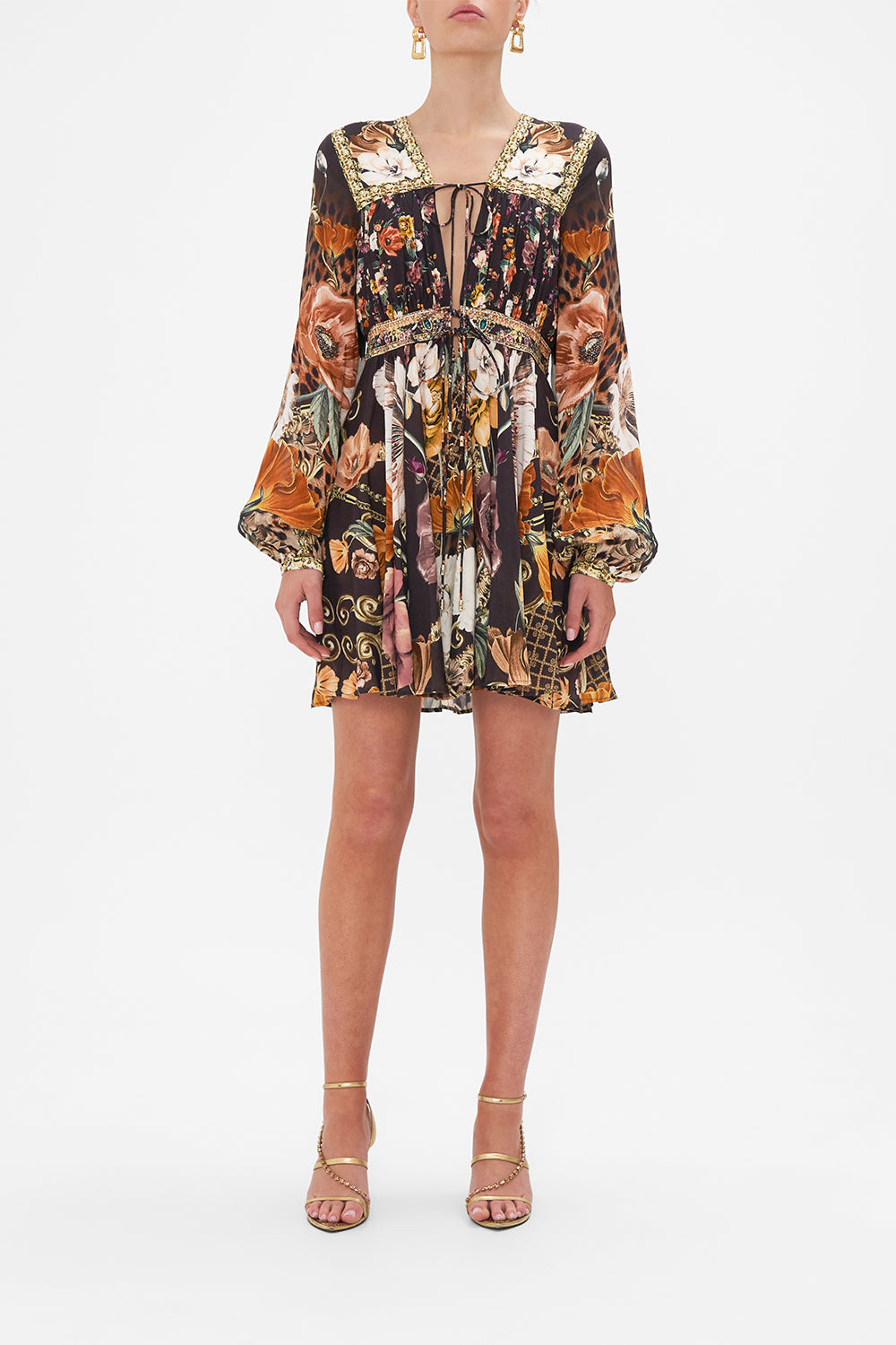 Front view of model wearing CAMILLA brown floral mini dress in Wave Your Wand print