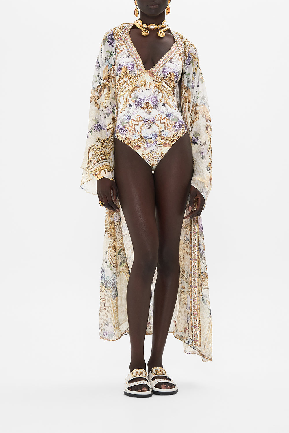 Detail view of model wearing CAMILLA resort wear one shoulder swimsuit in Palazzo Play Date print 