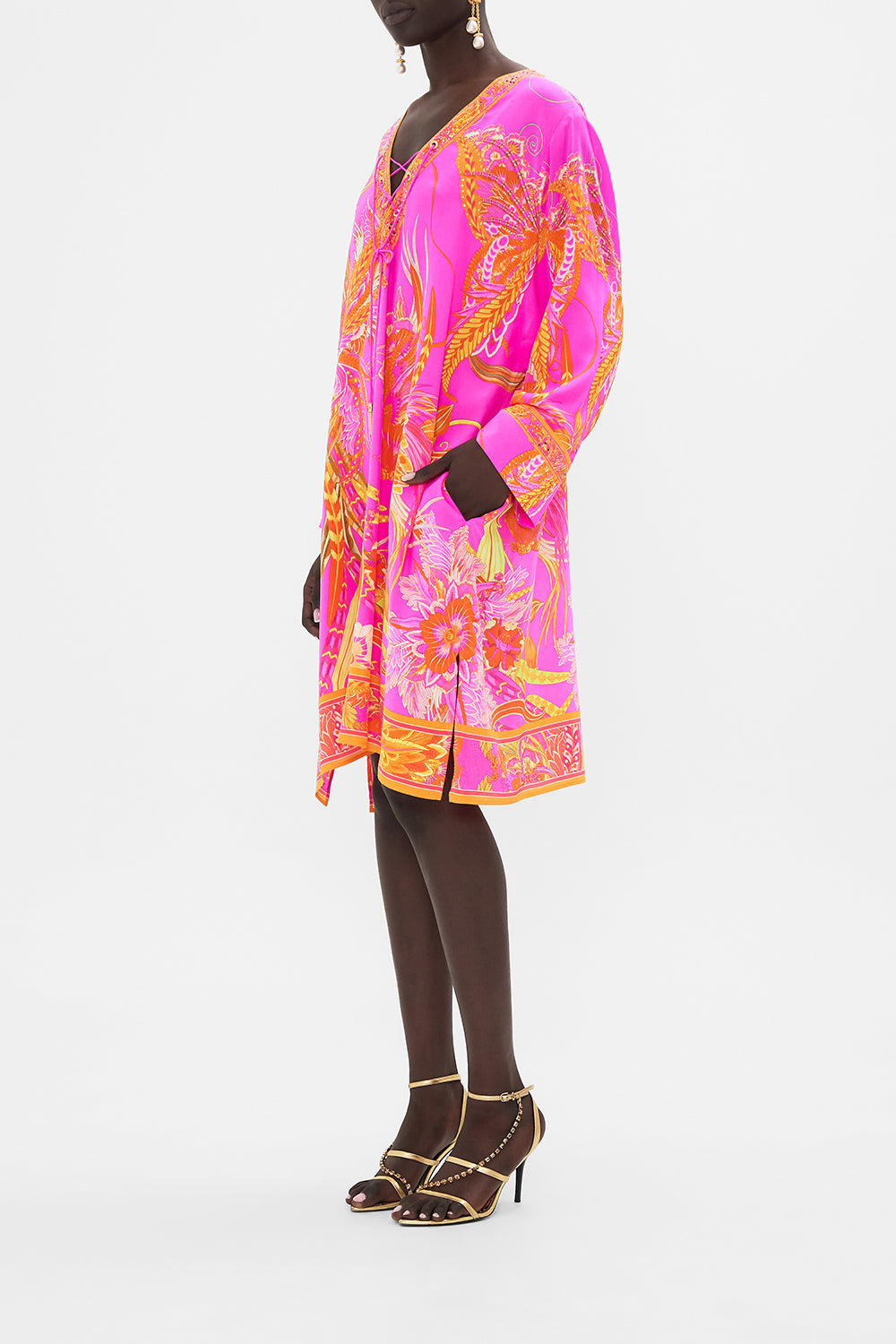 Side view of model wearing CAMILLA designer kaftan in A Heart That Flutters print