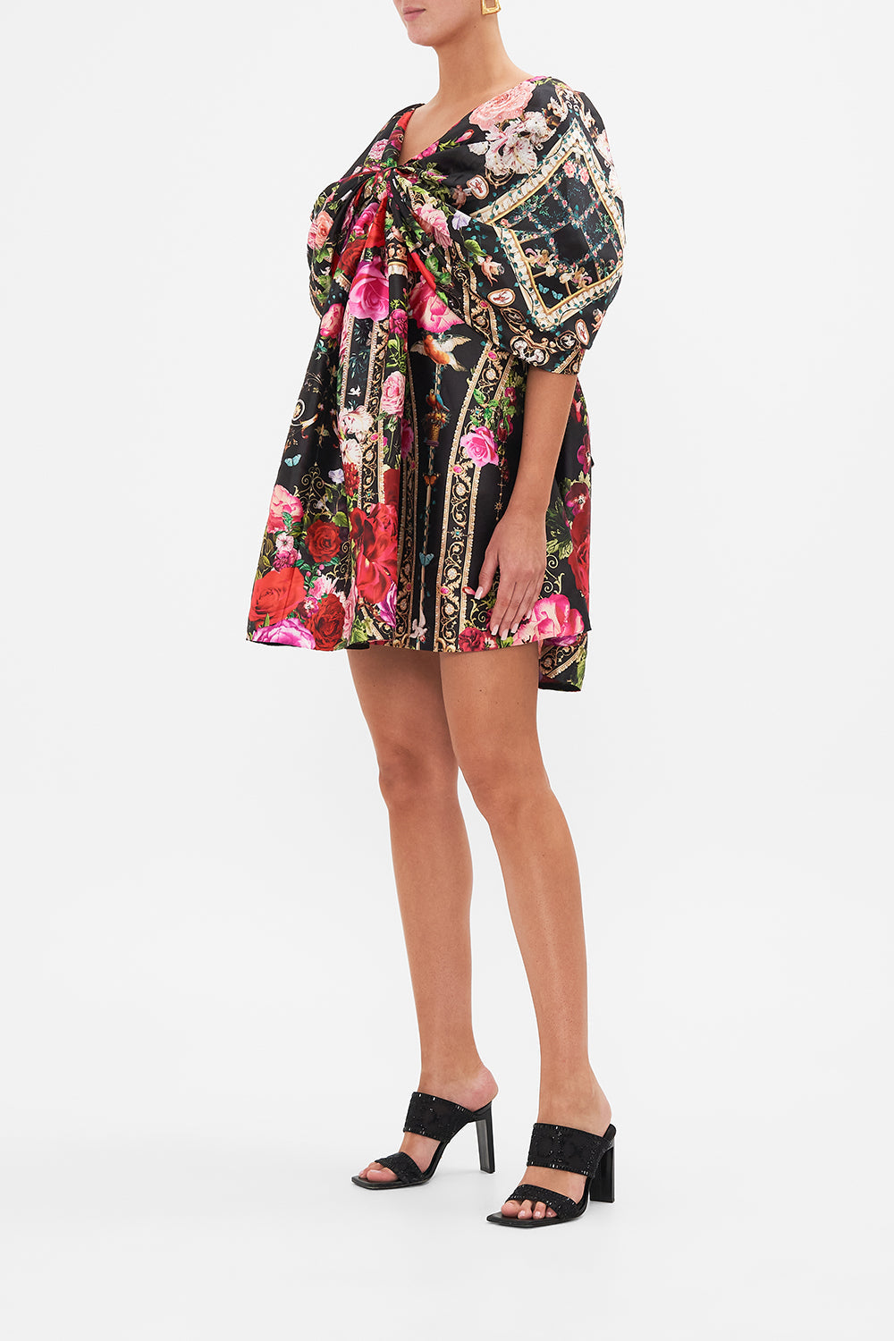 Side view of model wearing CAMILLLA taffeta mini dress in Reservation For Love print