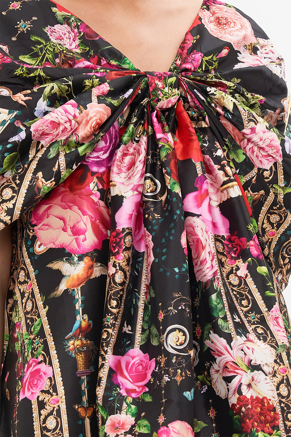 Detail view of model wearing CAMILLLA taffeta mini dress in Reservation For Love print