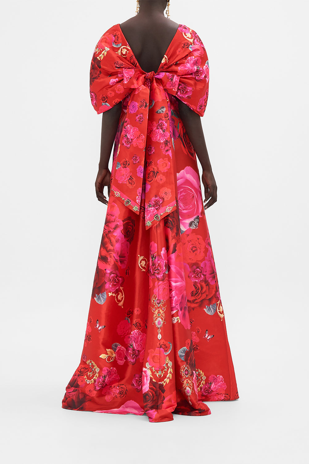 Back view of model wearing CAMILLA taffeta maxi dress with bow detail in An Italian Rosa print  