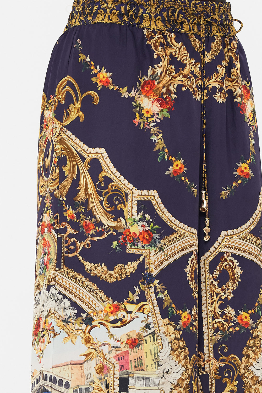 Detail view of model wearing CAMILLA silk pants in Venice Vignette print