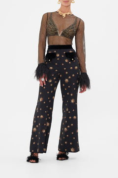 Front view of model wearing CAMILLAdesigner mesh top in Soul Of A Star Gazer print 