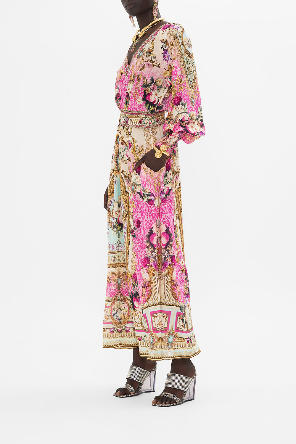 Side view of model wearing CAMILLA silk pink maxi dress in Call Of The Canal print 