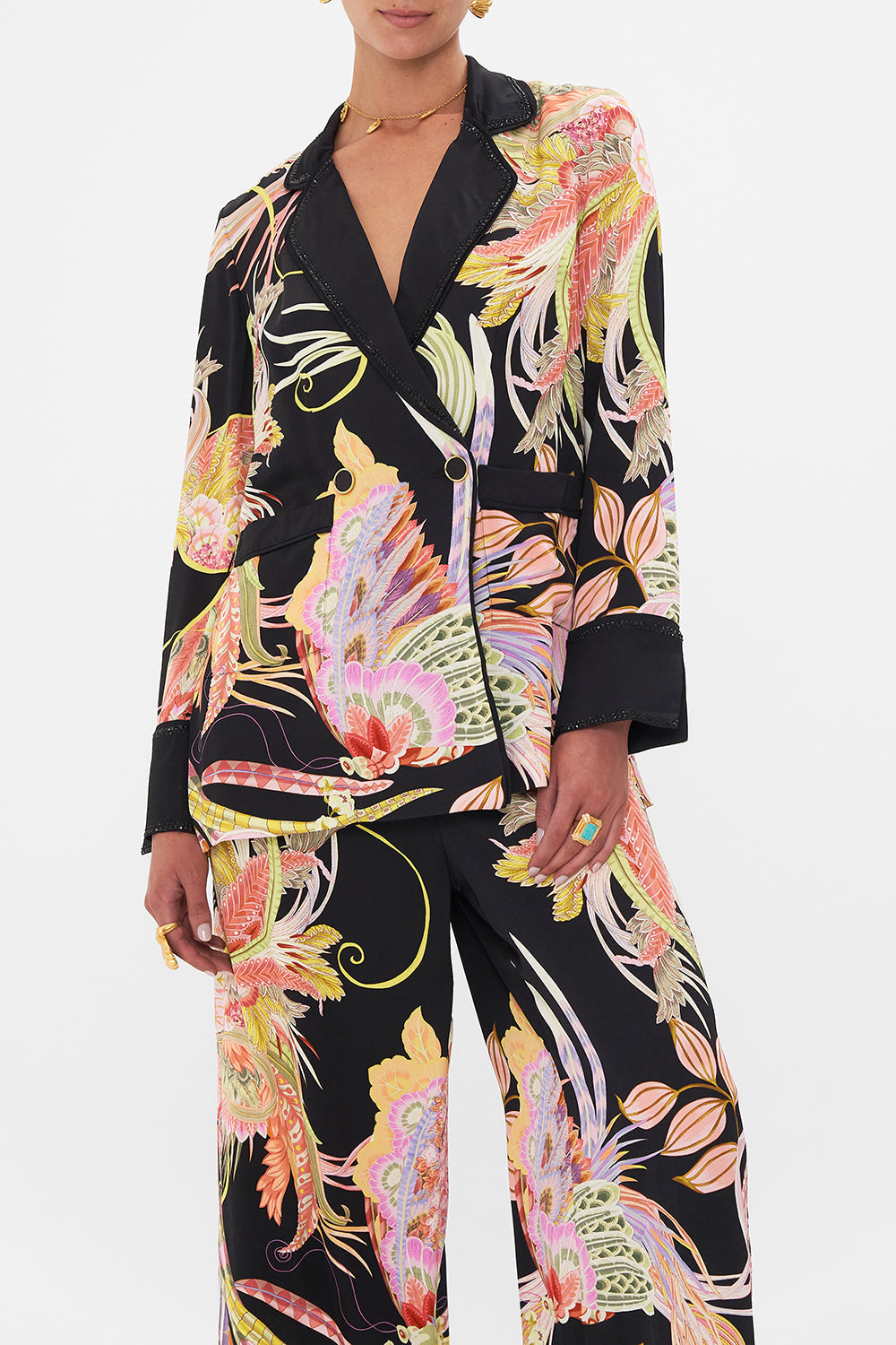 Crop view of model wearing CAMILLA deisgner jacket in lady of The Moon Print