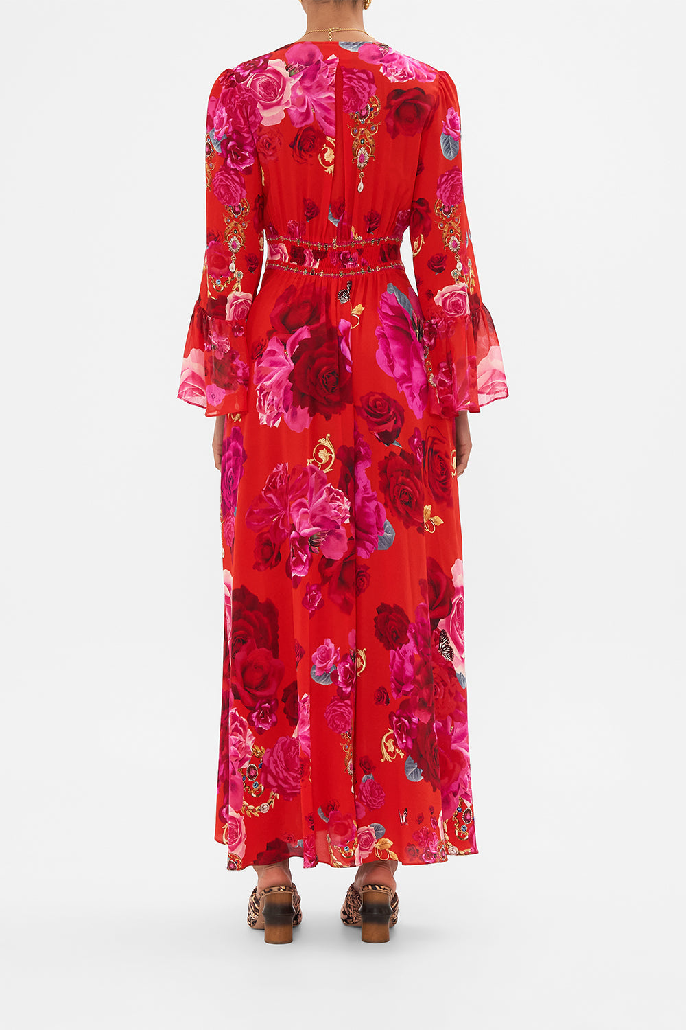 Back view of model wearing designer floral ruffle dress in An Italian Rosa print 