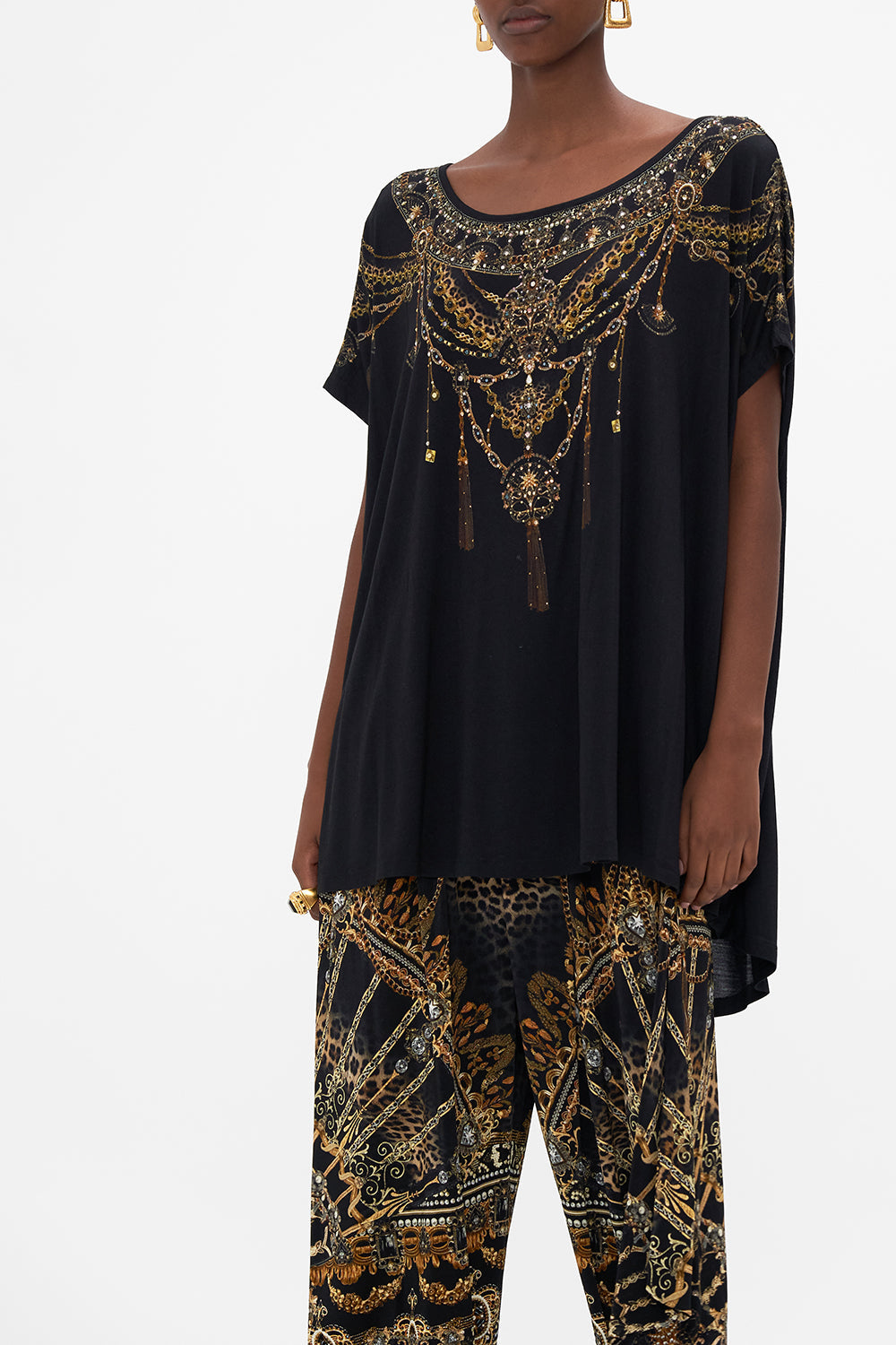 Crop view of model wearing CAMILLA luxury graphic tee in Masked At Moonlight print