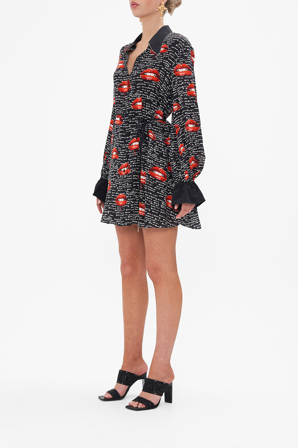 Side view of model wearing CAMILLA  black silk shirt dress in Chaos Magic print 