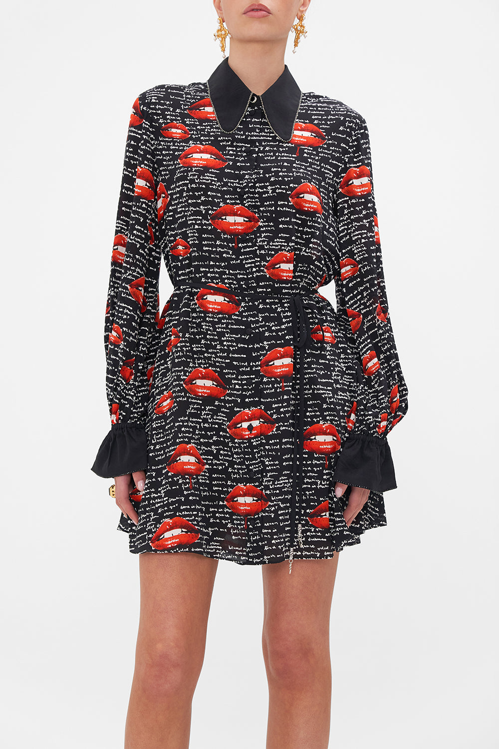 Crop view of model wearing CAMILLA  black silk shirt dress in Chaos Magic print 