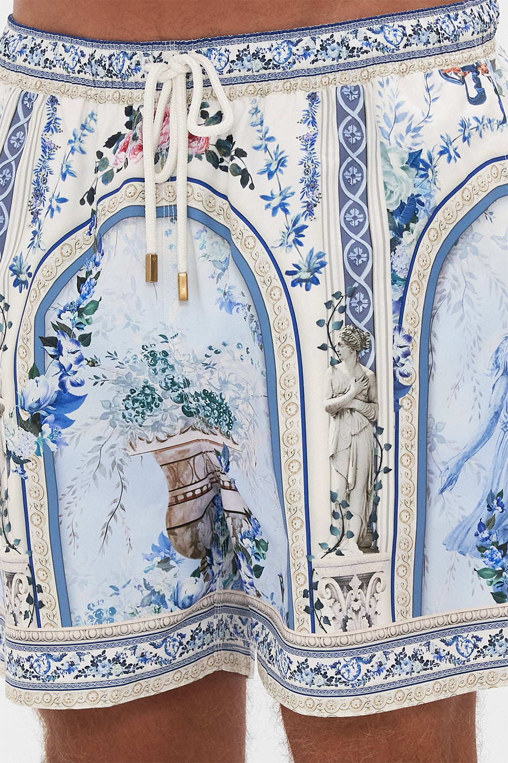 Detail view of model wearing Hotel Franks by CAMILLA mens boardshort in Season Of The Siren print 