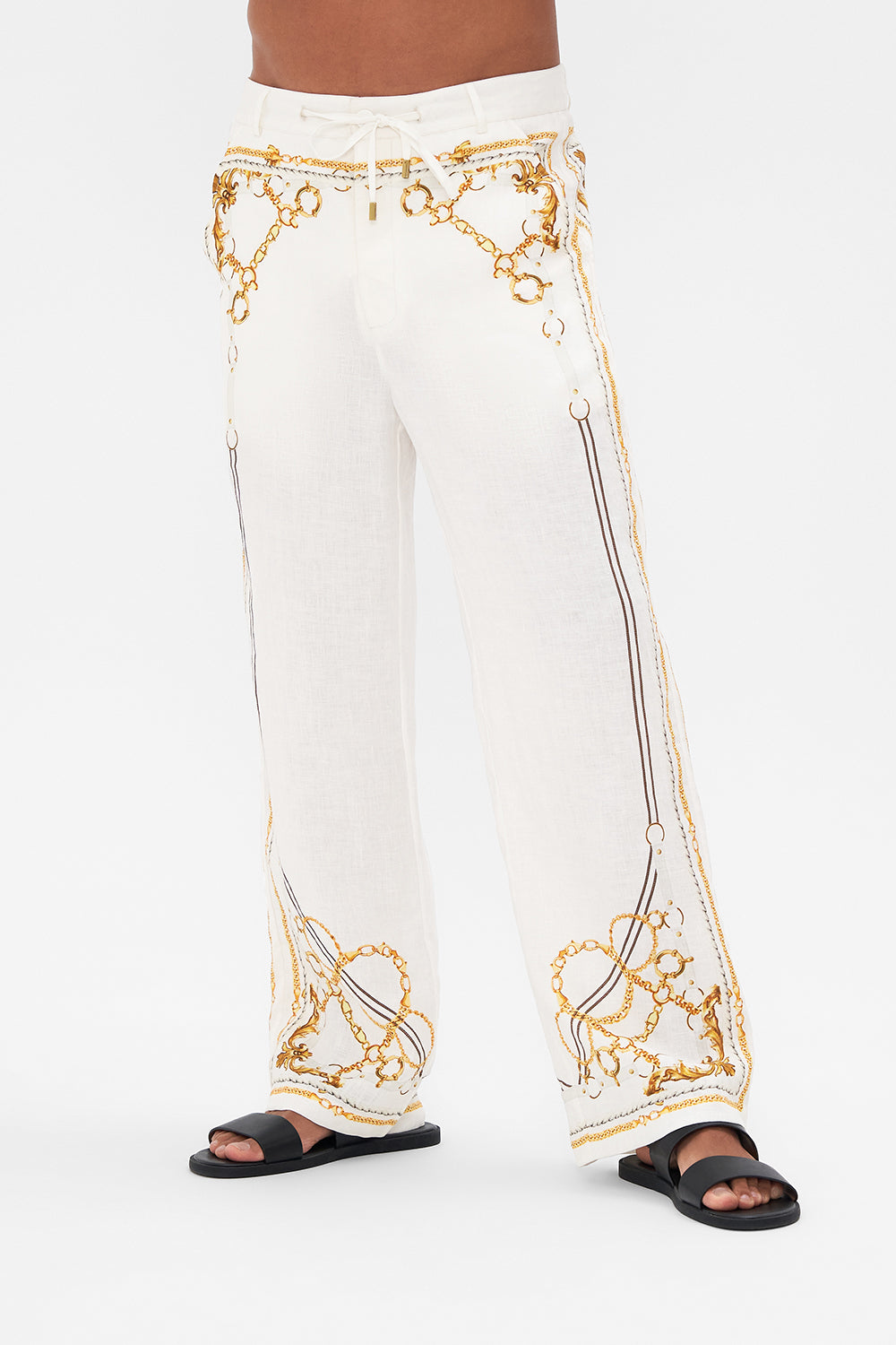 Crop view of model wearing Hotel Franks By CAMILLA mens linen pants in Coast to Coast print