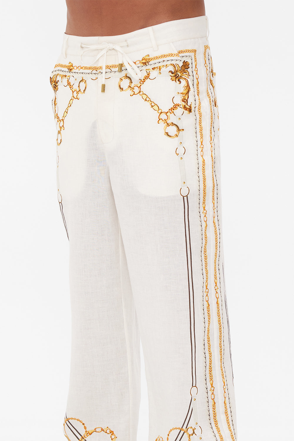 Detail view of model wearing Hotel Franks By CAMILLA mens linen pants in Coast to Coast print