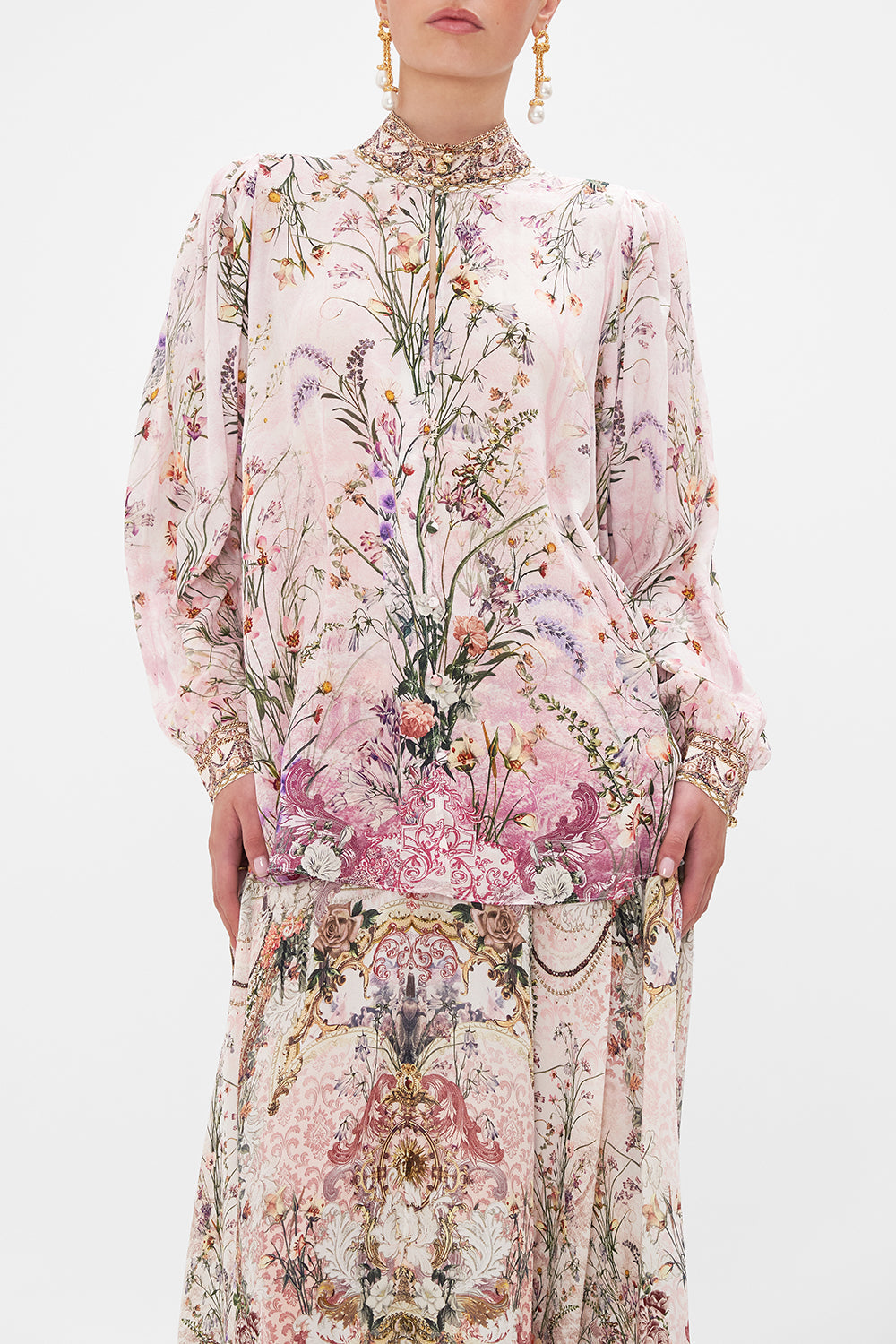 Crop view of model wearing CAMILLA floral slik blouse in Kissed By The Prince print