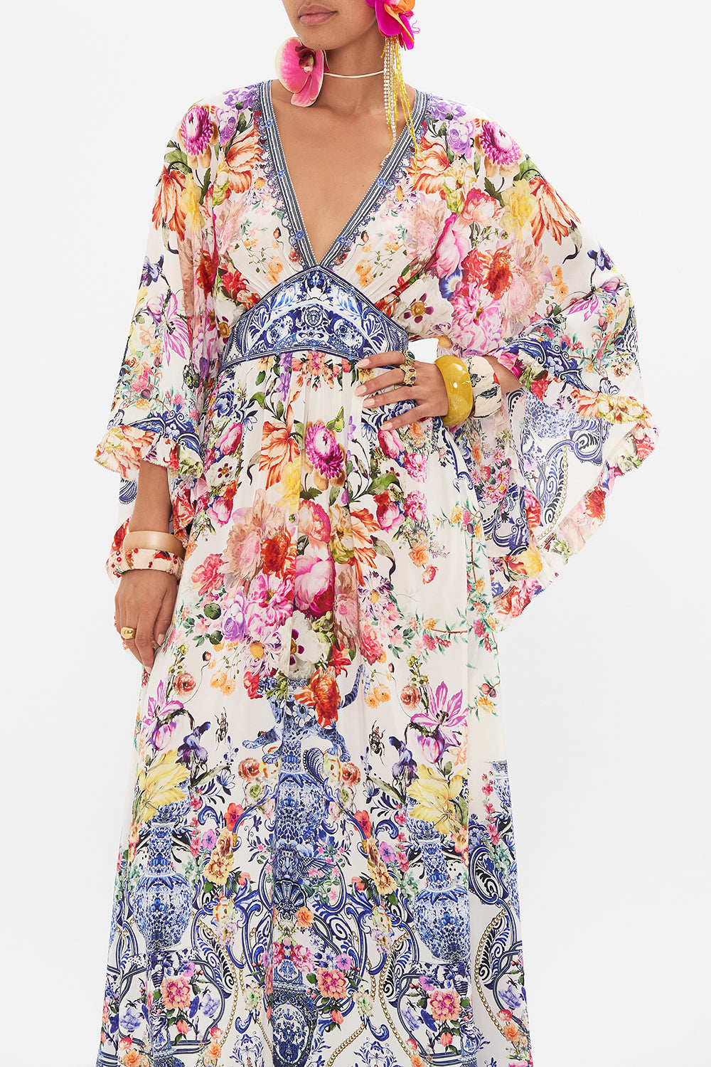 Crop view of model wearing CAMILLA silk dress in Dutch is Life print 