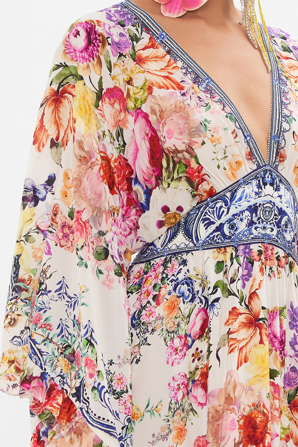 Detail view of model wearing CAMILLA silk dress in Dutch is Life print 