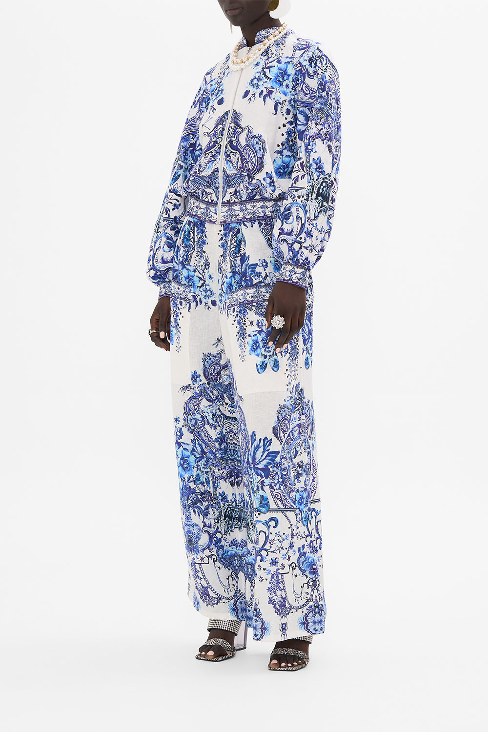 Side view of model wearing CAMILLA silk bomber jacket in Glaze and Graze print