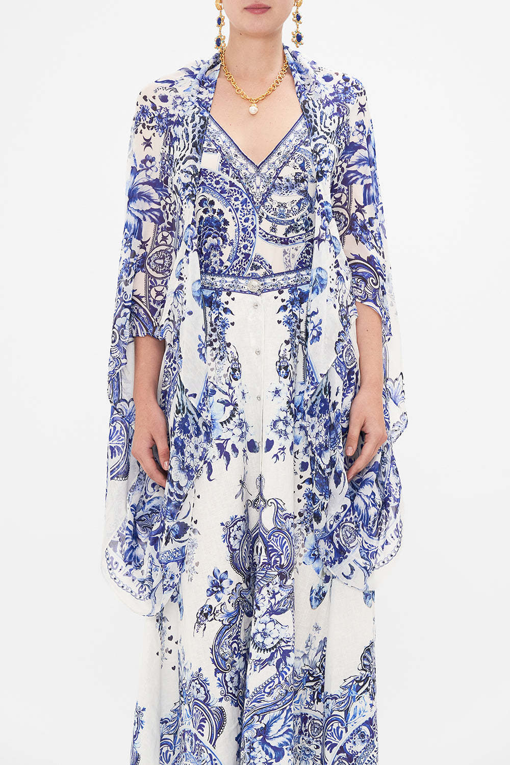 Crop view of model wearing CAMILLA silk shrug in Glaze And Graze print