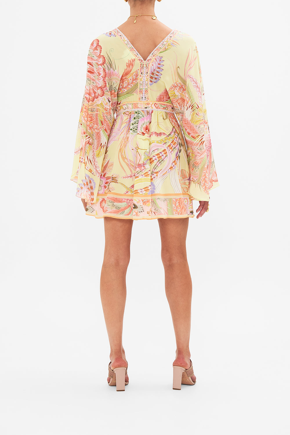 Back view of model wearing CAMILLA silk kimono mini dress in Cosmic Tuscan print 