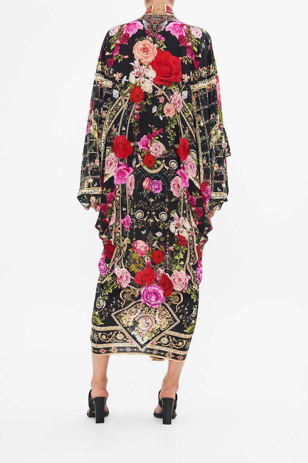 Back view of model wearing CAMILLA  designer resort wear silk kaftan print in Reservation For Love print 