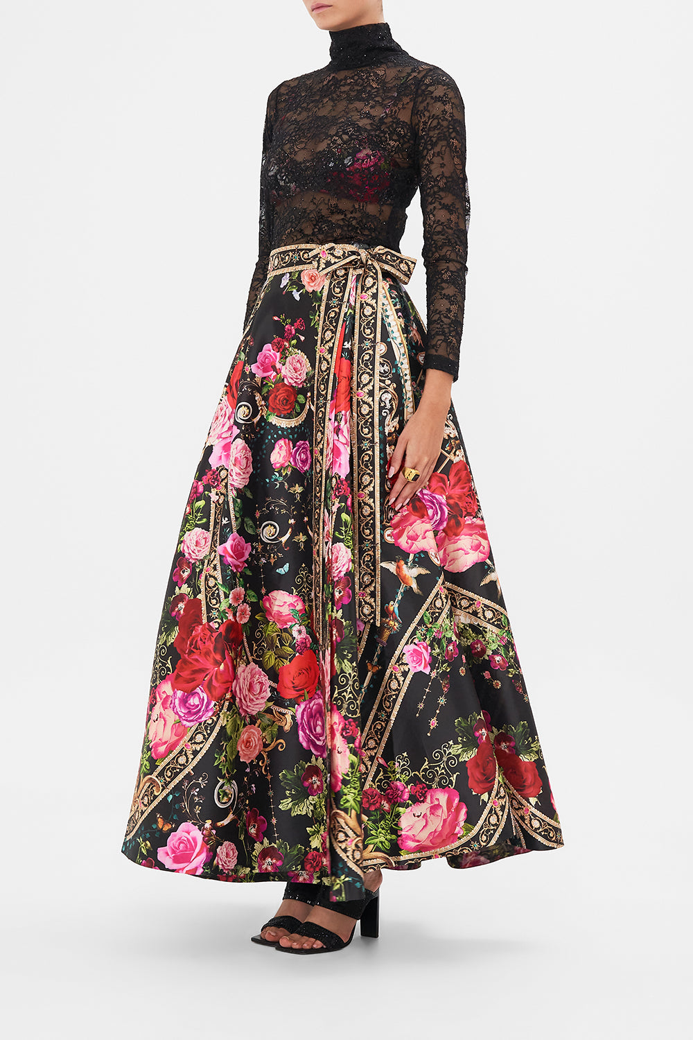 Crop view of model wearing CAMILLA designer maxi wrap skirt in Reservation Fot Love print 