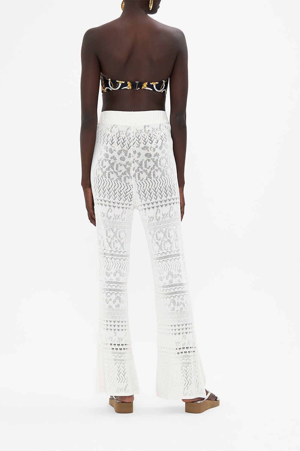 Back view of model wearing CAMILLA knit pants in Sea Charm 