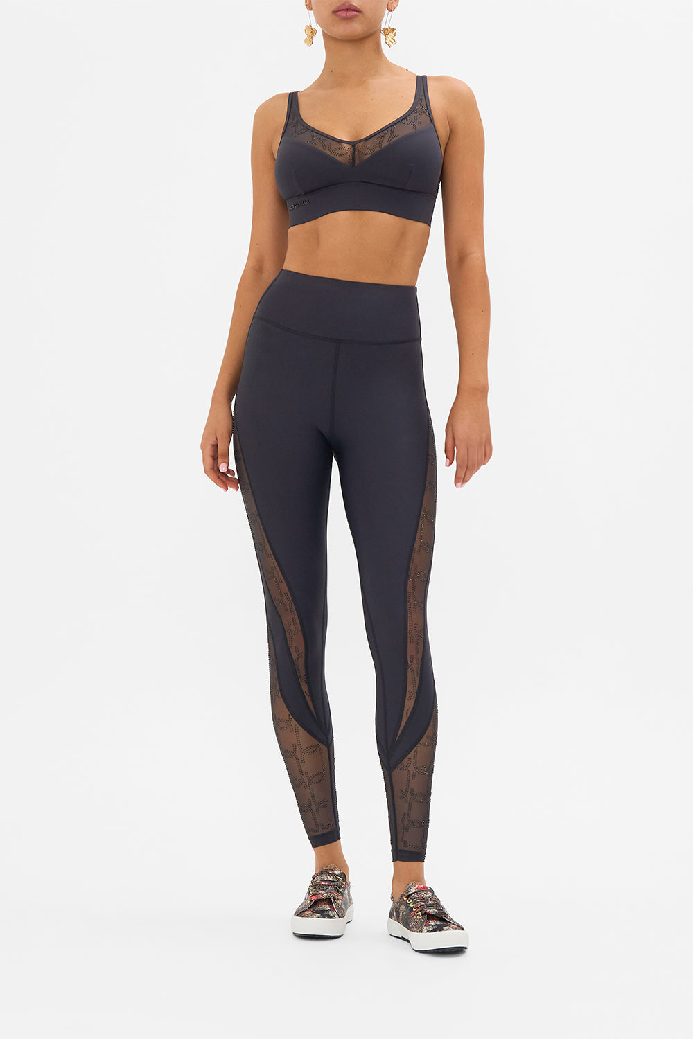 The CAMILLA MESH INSERT CROP SOLID BLACK in our SOLID BLACK print.