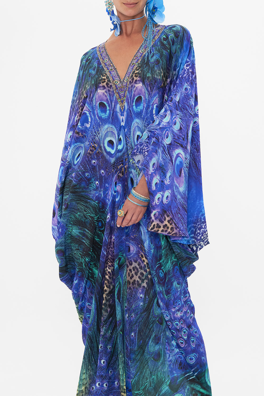 Crop view of model wearing CAMILLA silk kaftan in Peacock Rock print