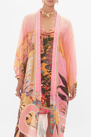 Crop view of model wearing CAMILLA silk kimono in Capri Me print