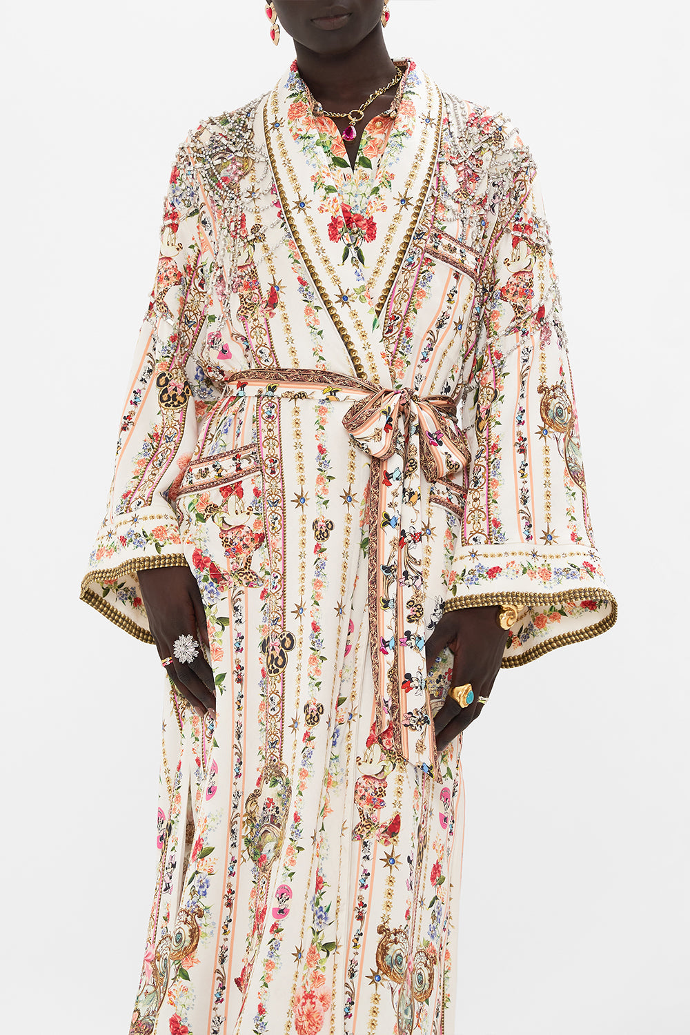 Detail view of model wearing Disney x CSAMILLA silk robe in Minnie Magic Forever print 
