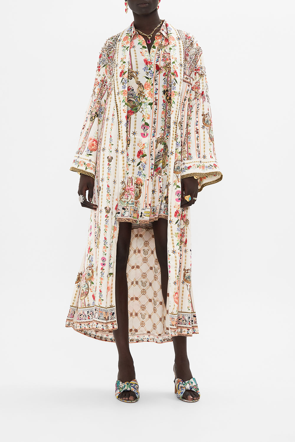Crop view of model wearing Disney x CSAMILLA silk robe in Minnie Magic Forever print 