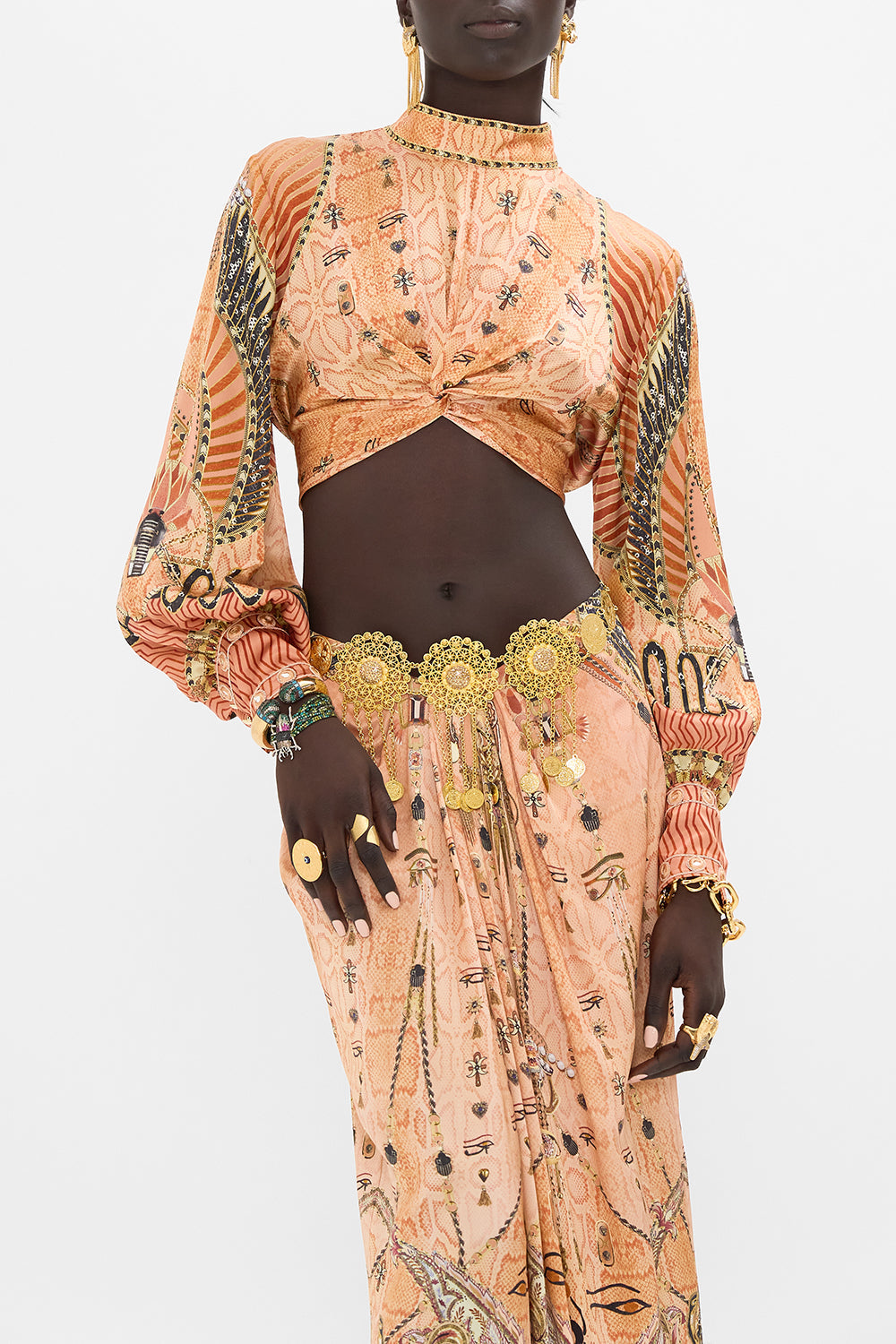 The CAMILLA LONG SLEEVE HIGH NECK TOP WITH FRONT KNOT KINGDOM OF HEIROGLYPHS in our  print.