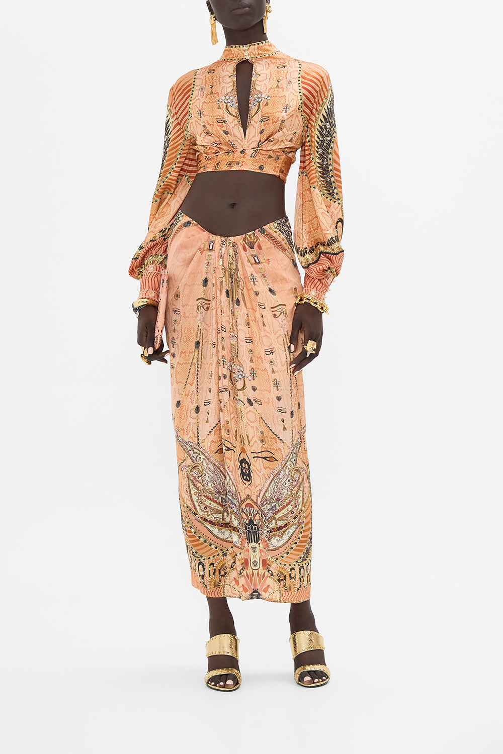The CAMILLA DRAPE FRONT SKIRT WITH SPLIT KINGDOM OF HEIROGLYPHS in our KINGDOM OF HEIROGLYPHS print.