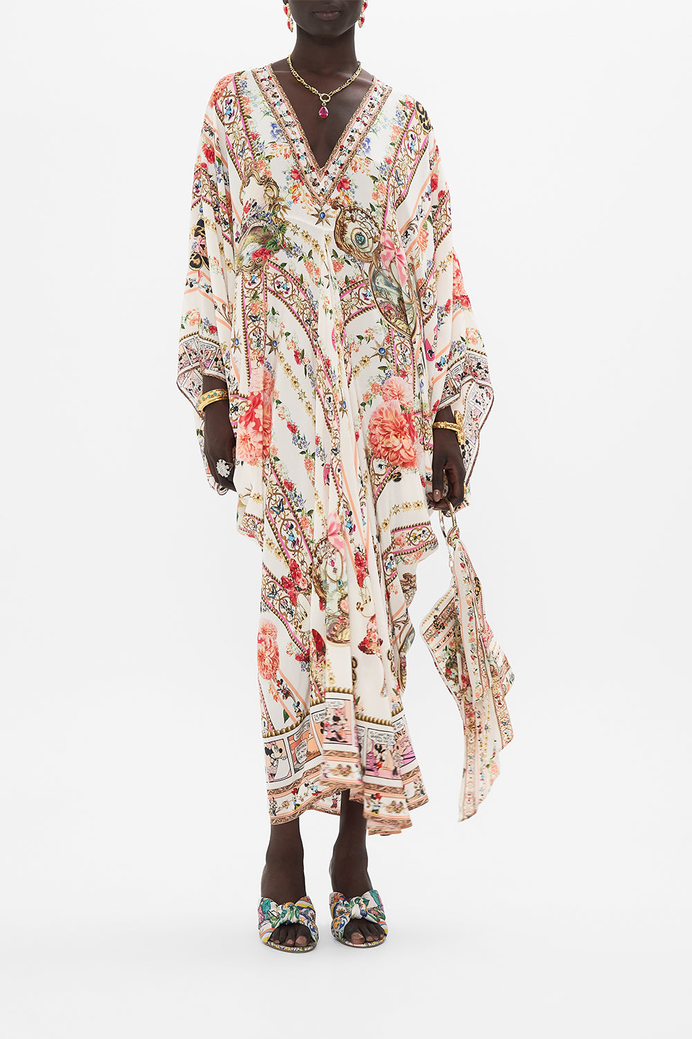 Front view of model wearing Disney x CAMILLA silk kaftan in Minnie Magic Forever print 