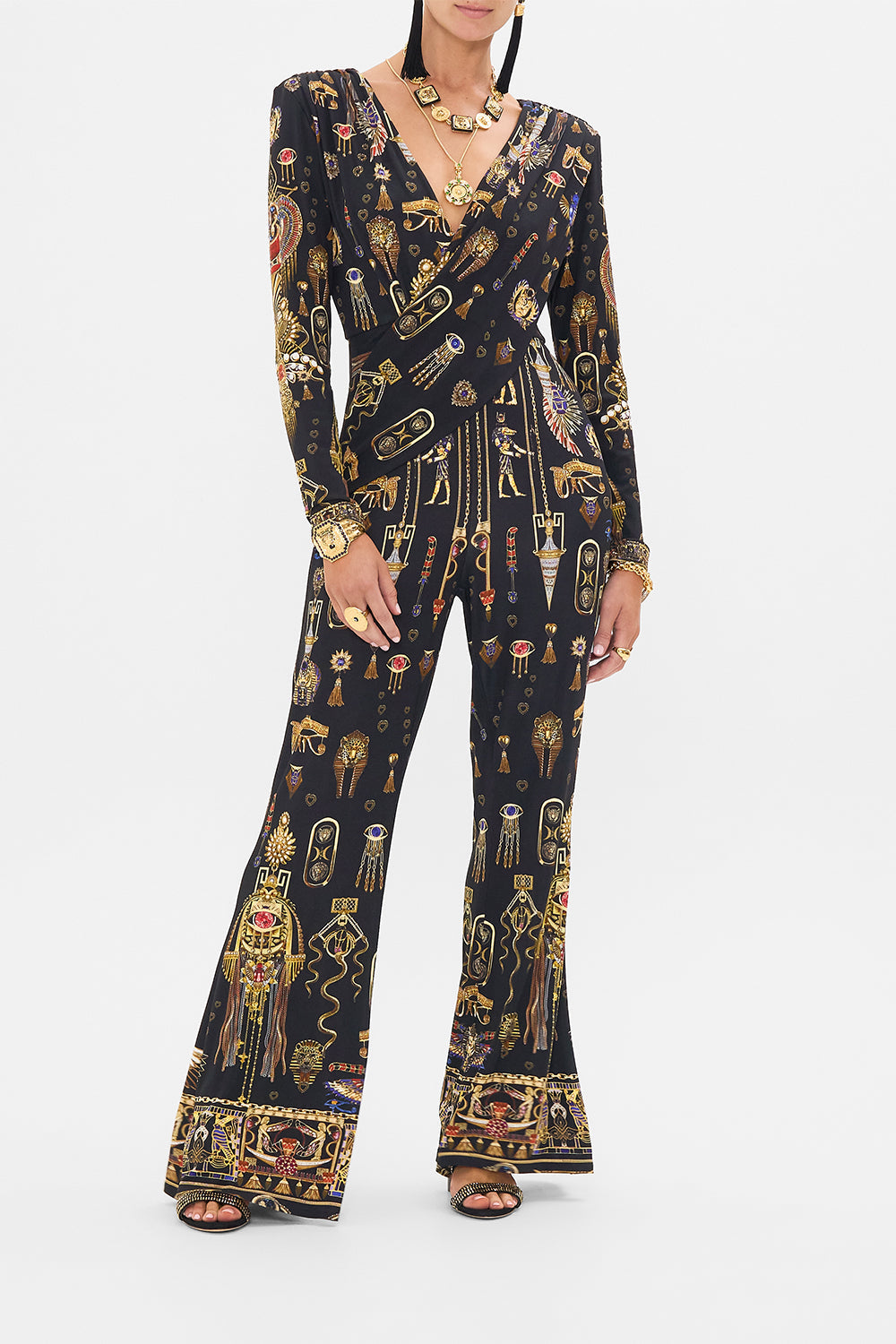 CAMILLA Draped V Neck Jersey Flared Jumpsuit in Cartouche Kingdom print. 