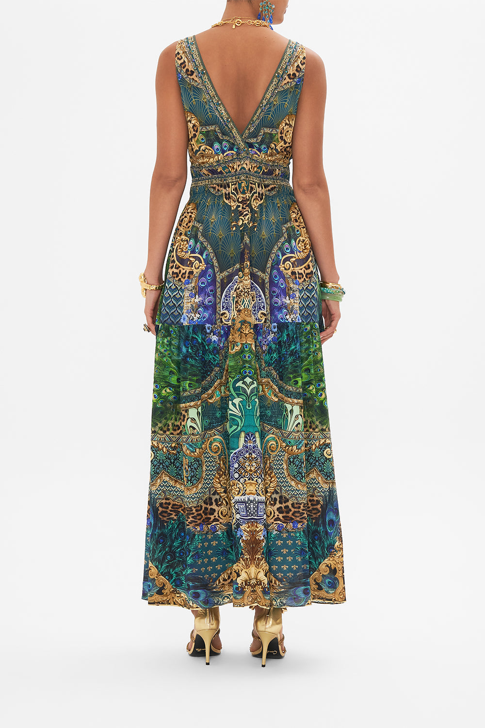 Back view of model wearing CAMILLA silk maxi dress in Peacock Rock print