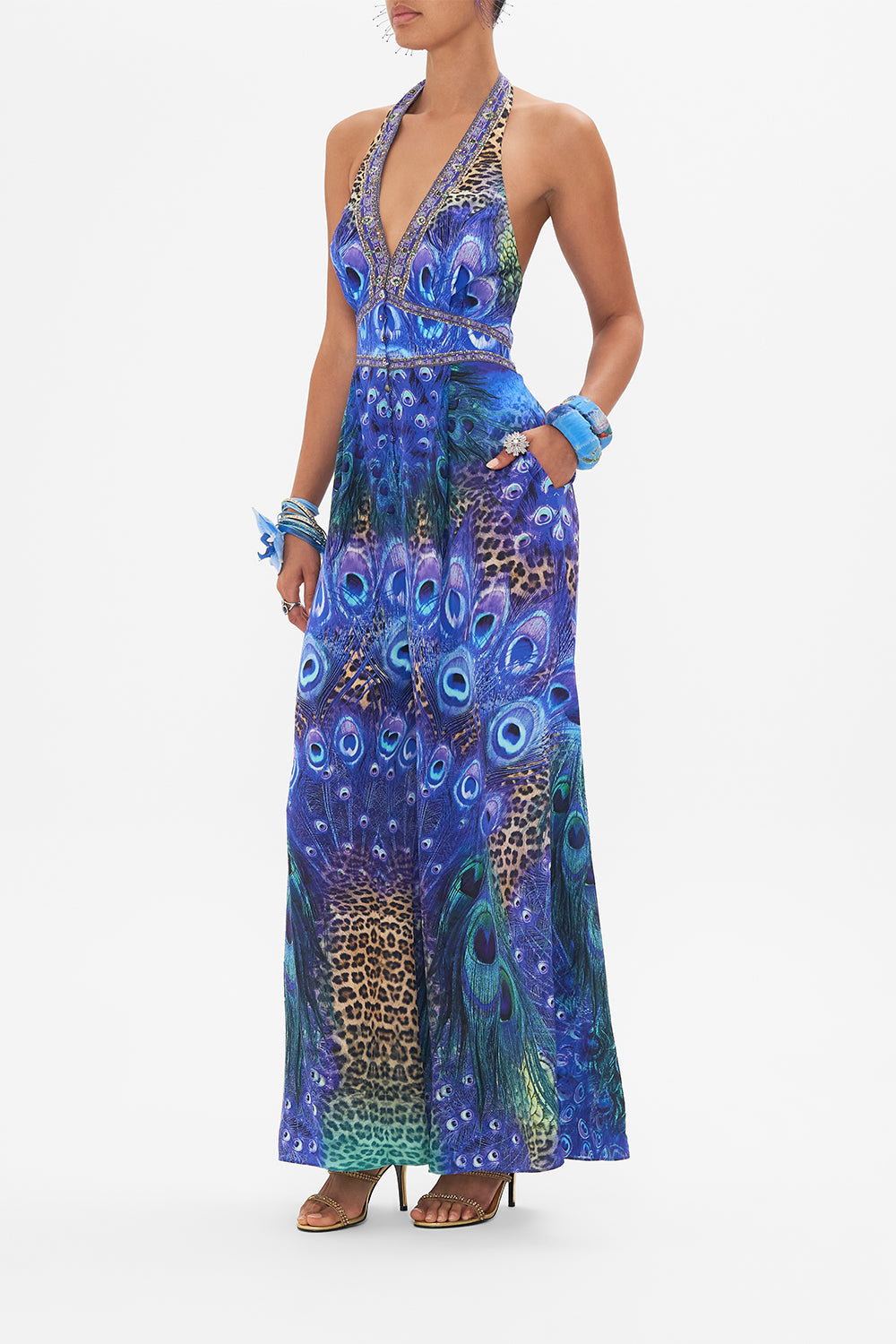 Side view of model wearing CAMILLA silk jumpsuit in Peacock Rock print