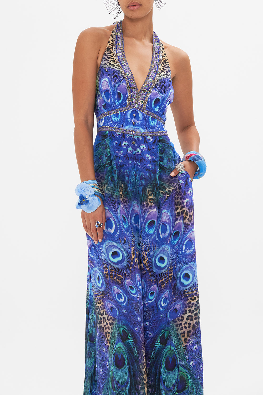 Crop view of model wearing CAMILLA silk jumpsuit in Peacock Rock print