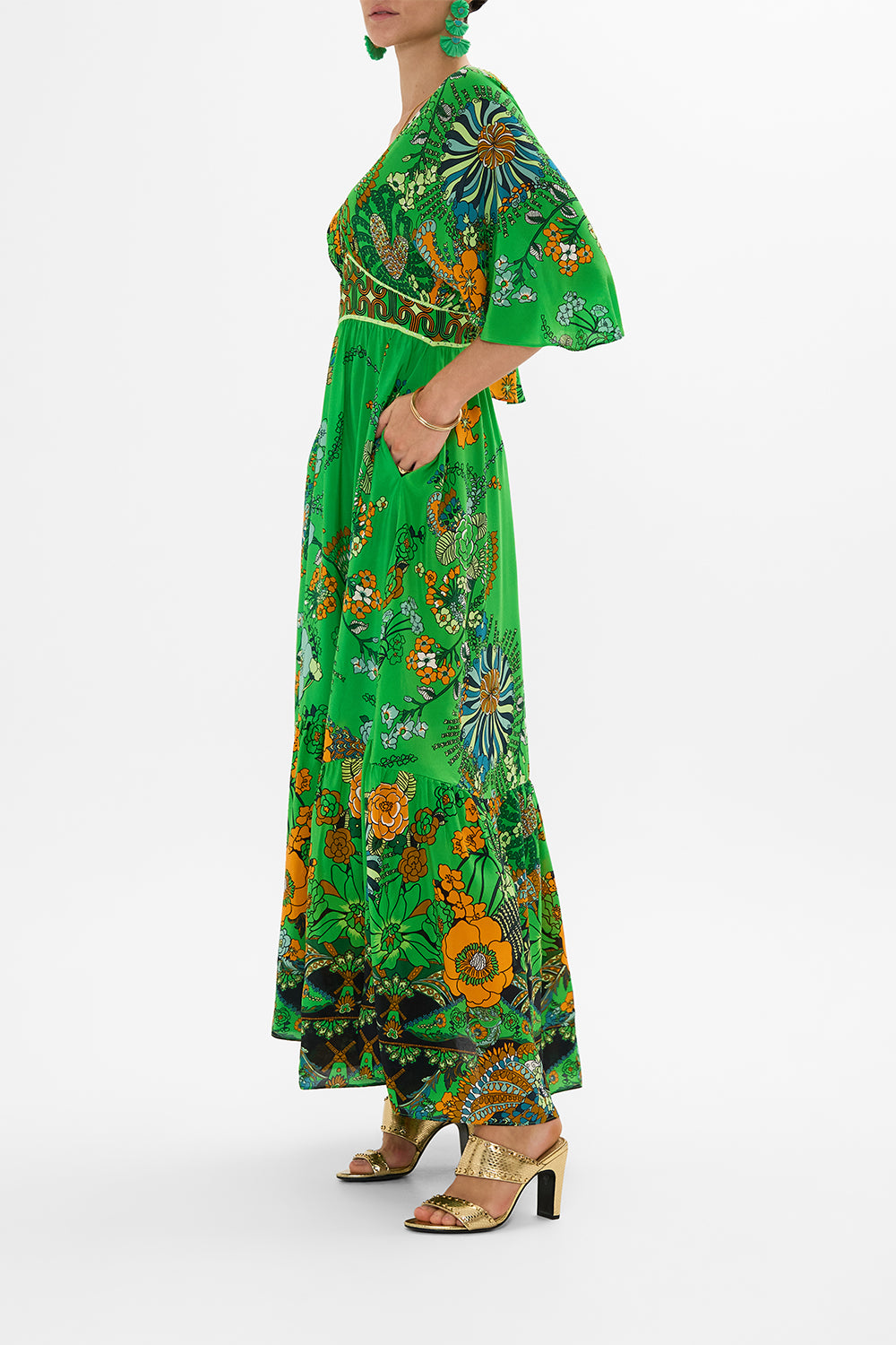 CAMILLA green waisted dress with hem ruffle in Good Vibes Generation print.