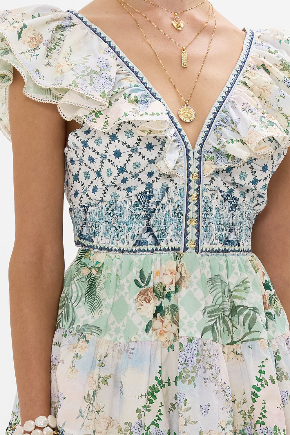 The CAMILLA TIERED SHORT DRESS WITH NECK FRILL JARDIM PARTY in our  print.