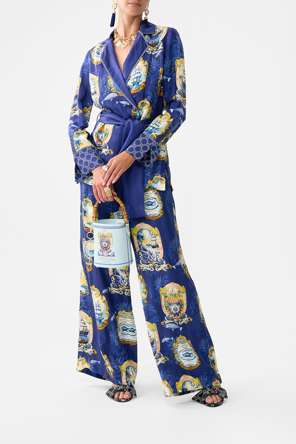 The CAMILLA DRAWSTRING BUCKET BAG SONG OF SAINT ANTHONY in our  print.