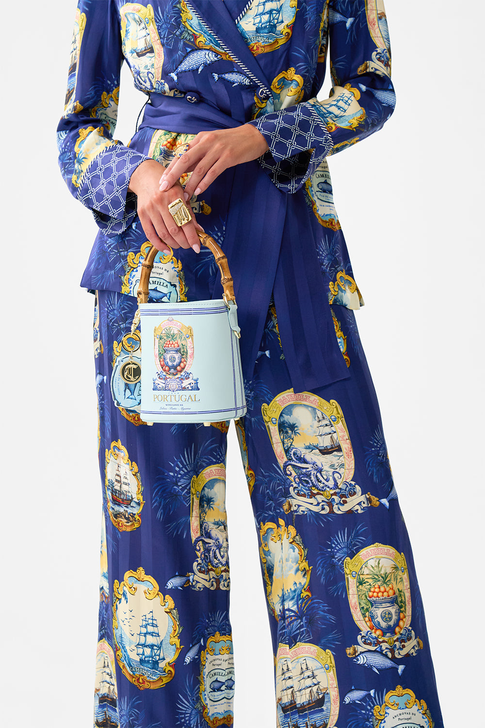 The CAMILLA DRAWSTRING BUCKET BAG SONG OF SAINT ANTHONY in our  print.