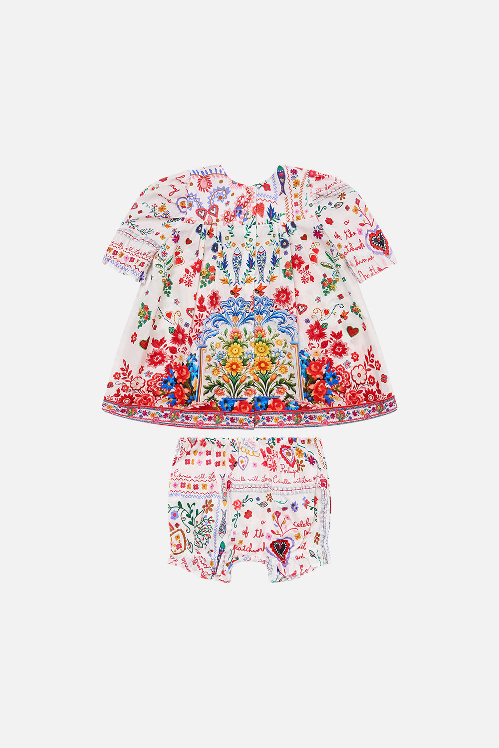 The CAMILLA BABIES PUFF SLEEVE TOP AND BLOOMER SET FAITH, LUCK & JUSTICE in our  print.