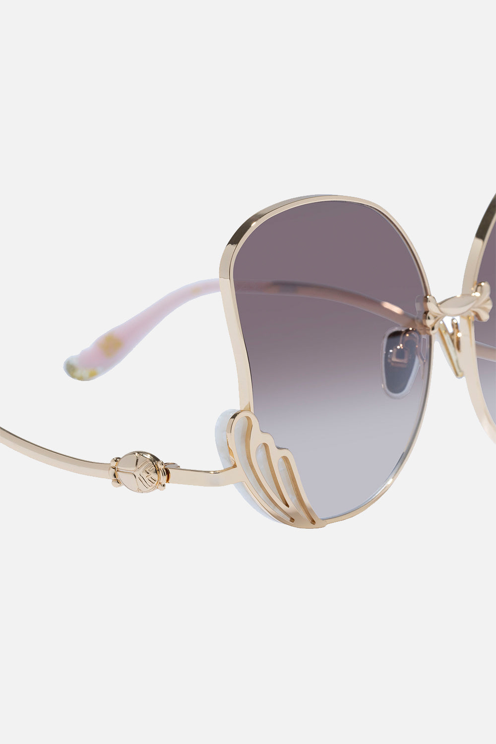 The CAMILLA GODDESS ENERGY SUNGLASSES IVORY MARBLE in our  print.