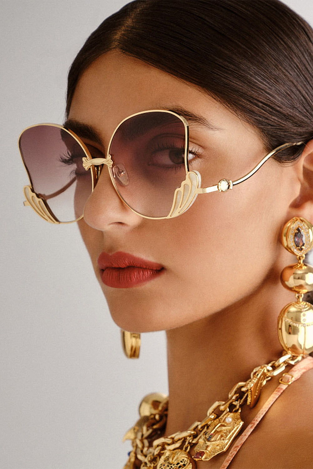The CAMILLA GODDESS ENERGY SUNGLASSES IVORY MARBLE in our  print.