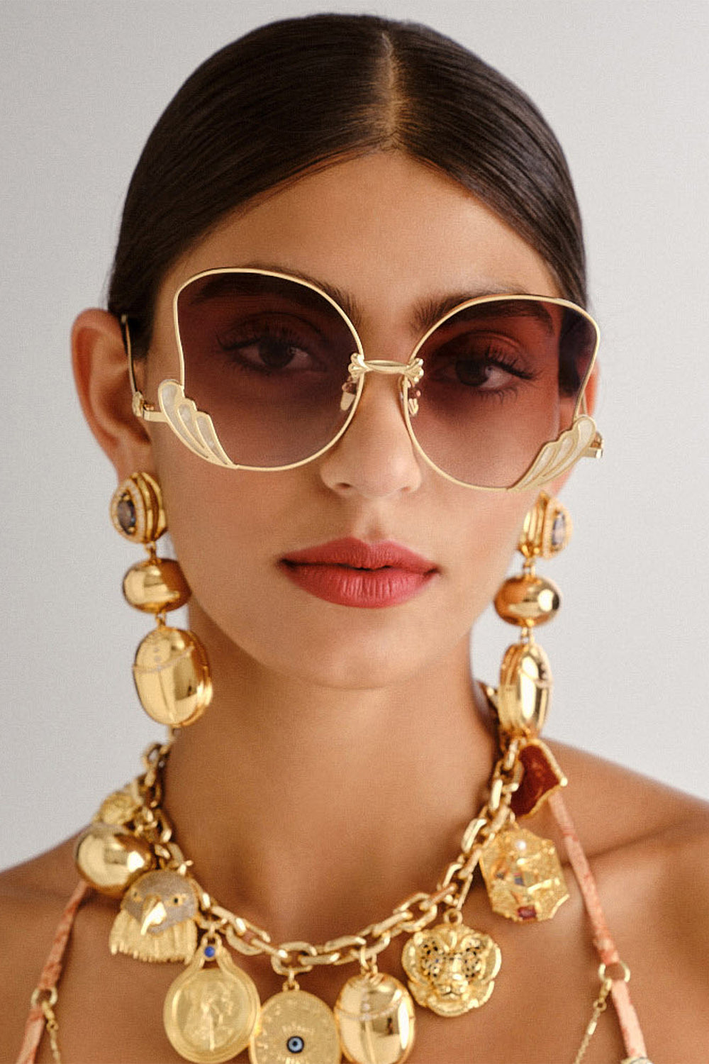 The CAMILLA GODDESS ENERGY SUNGLASSES IVORY MARBLE in our  print.
