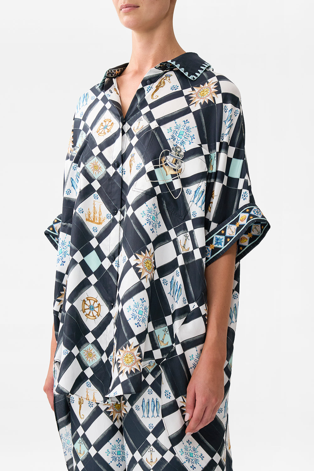 The CAMILLA OVERSIZED POCKET TUNIC FOLK AFLOAT in our  print.