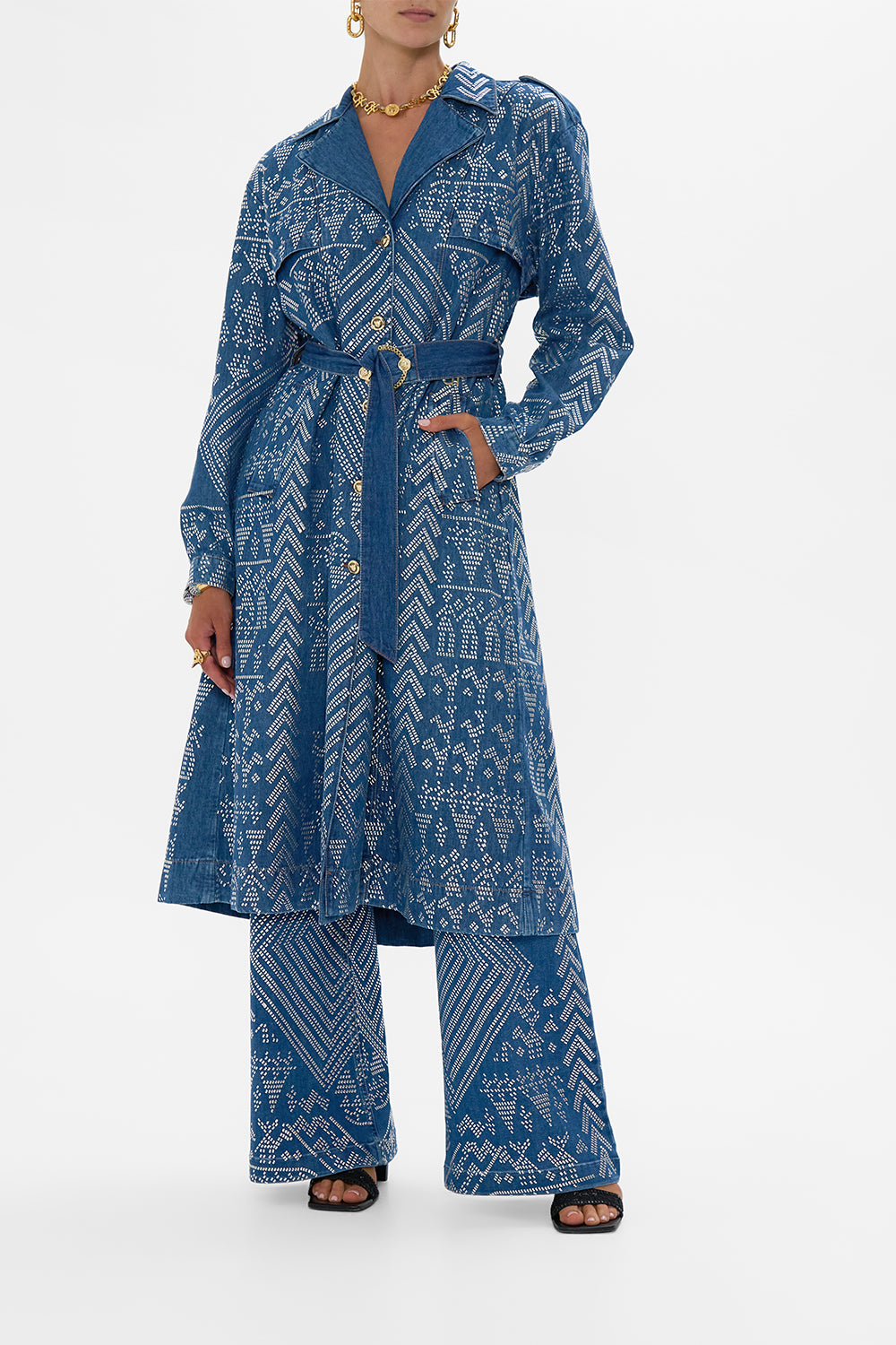 The CAMILLA DESERT REIGN LONGLINE BELTED TRENCH COAT DENIM in our DENIM print.