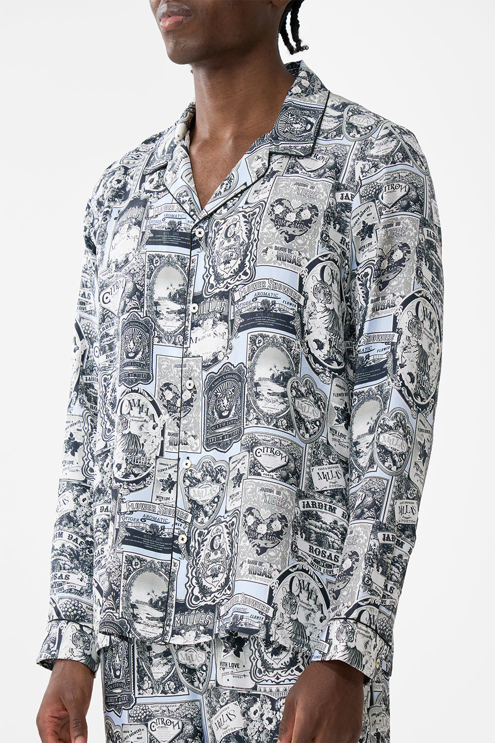 The CAMILLA LONG SLEEVE CAMP COLLARED SHIRT FLOWER SHOWERS in our  print.